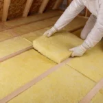 Fibreglass batt installation in an attic